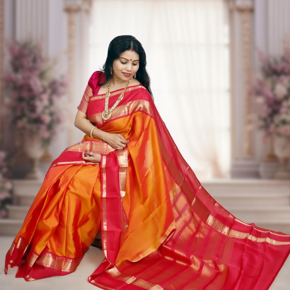 Handwoven Kanchipuram Silk Saree – Orange Base with Rani Pink & Golden Zari Border