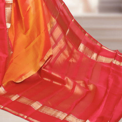 Handwoven Kanchipuram Silk Saree – Orange Base with Rani Pink & Golden Zari Border